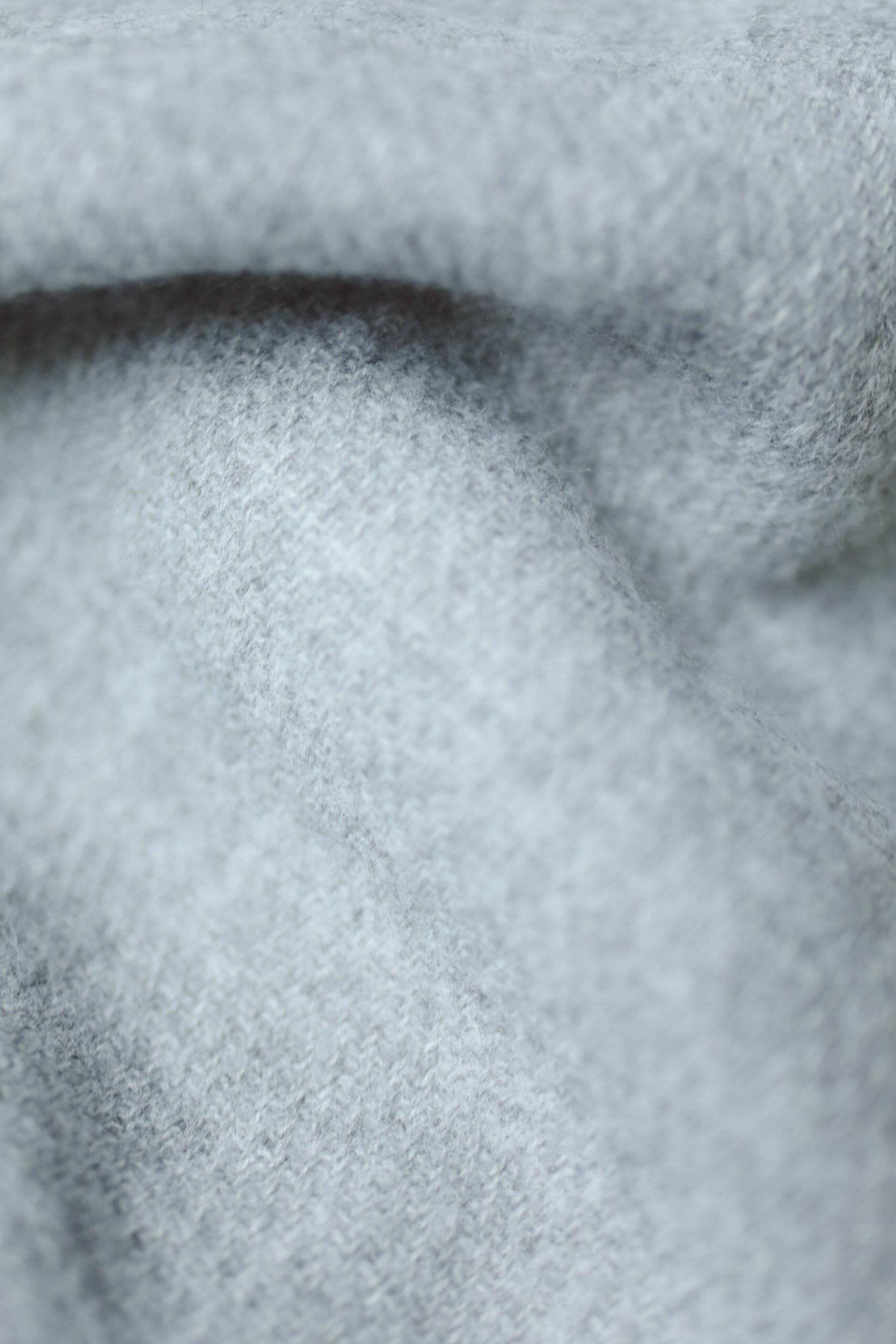 Close-up fabric texture showing textile thickness and knit structure