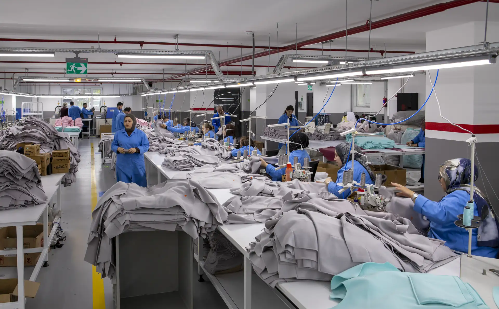 Cut and sew hoodie production with custom garment panels, ribbing and sewing construction