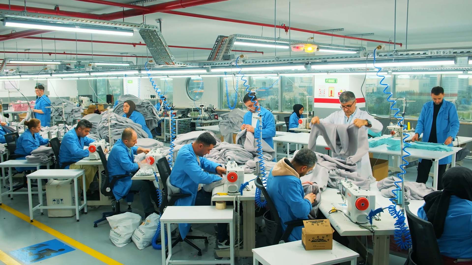 Approved hoodie sample compared with technical specifications for garment reorder production