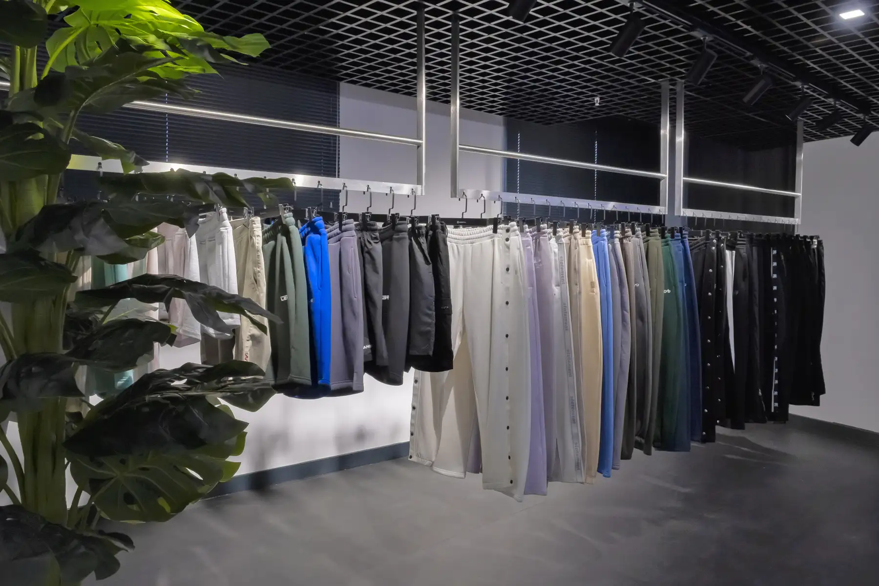 Garment production batches in different colorways showing MOQ impact on clothing manufacturing